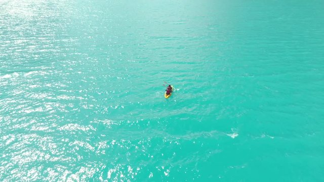 Paron lake, couple in middle of lake kayakin, aerial shoot, adventure travel.