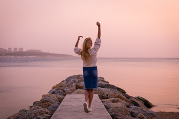 Blonde model on the beach at summer