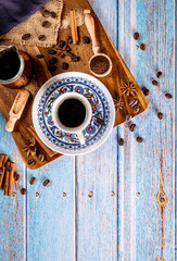 Cup of hot turkish coffee on a old vintage blue background