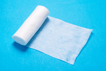 White roll of non woven bandage on  background