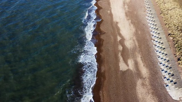 waves crashing on beach drone footage	 4K video