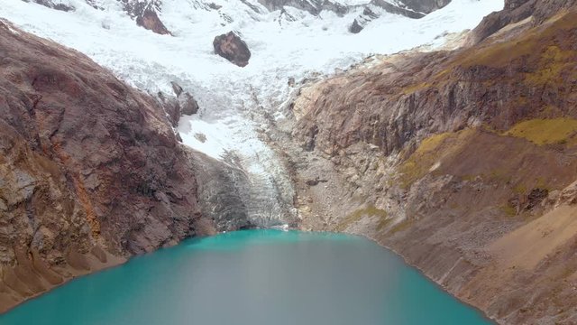 Panoramic view of Arhuaycocha lake in the santa cruz trek, peruvian andes, effects of the global warming lake.