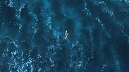 Surf Man On White Surfboard Swimming On Ocean Background. Beautiful Blue Water Space With Waves. Top View.  - Powered by Adobe