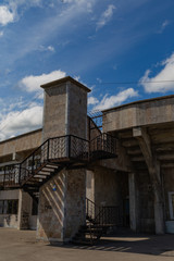 Fototapeta na wymiar building with metal stairs blue sky