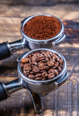 Coffee beans in a Coffee machine Coffee handle Filter Holder on a wooden table