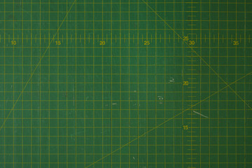 green cutting mat scale with scratch texture from cutter
