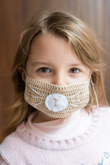 girl using a mask against coronavirus