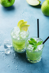 Green cocktail with ice and mint