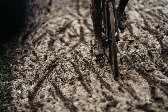 Cyclocross Worlds racing in mud close drive trails