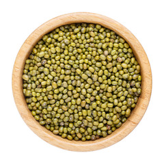 Fototapeta premium Dried mung bean (green gram, maash or moong) in wooden bowl isolated on white. Top view.