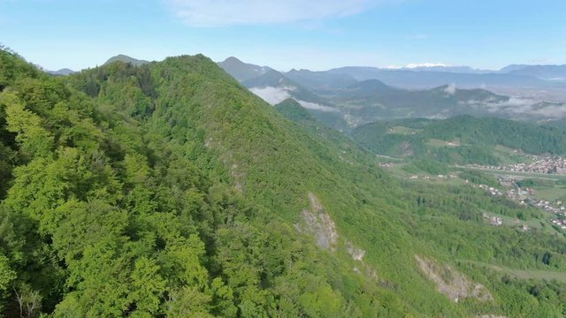 Aerial Drone Shot of Peaks of Dinaric Alps and Kocevje Town in Slovenia