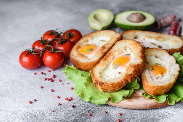 Delicious breakfast with grunts, eggs, avocado and cherry tomatoes