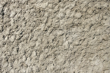 uneven surface of the plaster on the gray