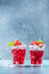 Red cocktail with ice and mint