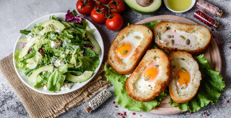 Delicious breakfast with grunts, eggs, avocado and cherry tomatoes