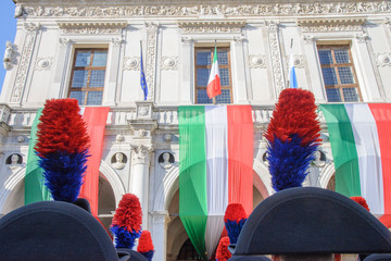 Day of the Unification of Italy and the armed forces, 4 November, piazza della Loggia, Brescia Italy. Carabinieri "Lucerna" hat detail with tricolor flags of the Italian Republic background.