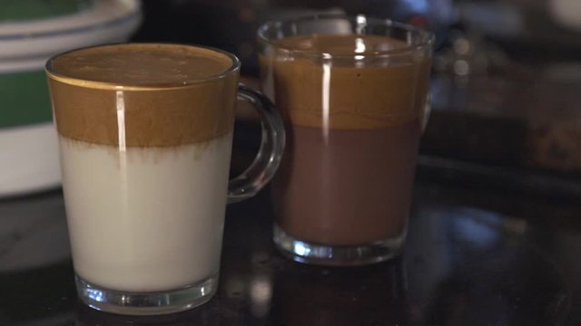 Two Delicious Glass Of Chocolate And Milk Layered Latte.- closeup shot 