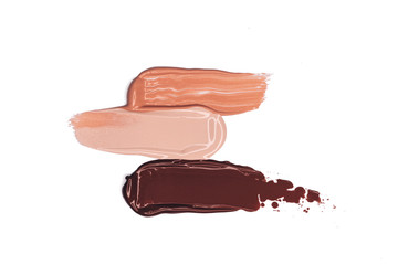 Makeup foundation smudges isolated on white background