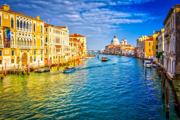 Grand canal and Basilica Santa Maria della Salute, Venice, Italy. Beautiful view on boats and vaporetto in Grand canal - obrazy, fototapety, plakaty