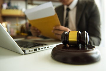  justice advice and law judge legislation concept. tribunal Attorney lawyer working with documents and white gavel on tabel
