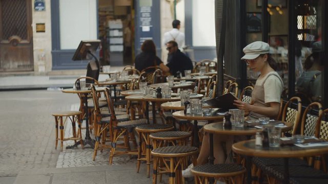 Attractive woman with a menu in a cafe 
