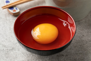 Japanese raw egg in a bowl close up