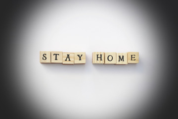 A close up of a sign saying Stay Home