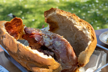 Italian festive homemade food, whole baked Prosciutto ham in a bread crust. Close up of the inside of the crust in the baking pan, with the hot ham giving off its delicious juices and fats.