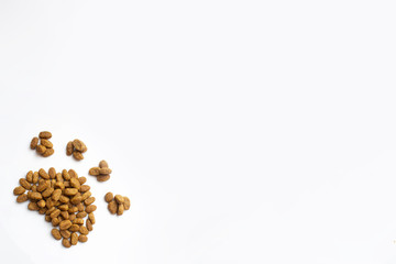 cat food in the white background is laid out in the word cat paws. white background for text and feed ads.