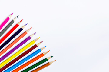Color pencils lying on a light background