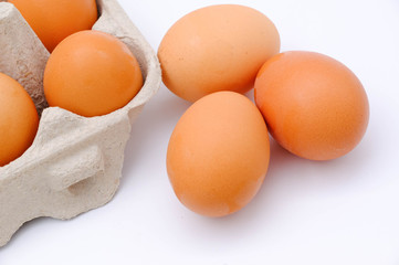 Close-up view of raw chicken eggs on background