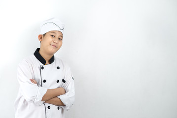 Japanese food chef in uniform crossing arms on wall.