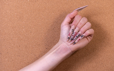 Hands with artificial nails in different style