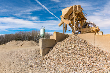 Quarry aggregate with heavy duty machinery.