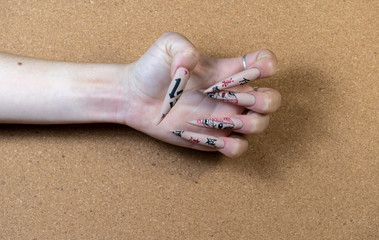 Hands with artificial nails in different style