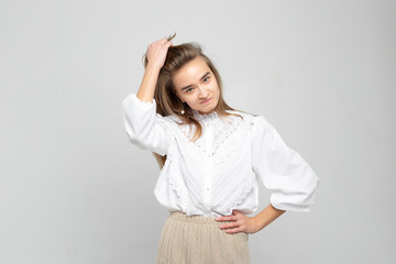 Fototapeta premium Very angry woman. Frustration. Frustrated and stressed young businesswoman. Beautiful young mixed race asian / caucasian woman isolated on white background.