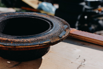 Very old change brake disc on car in a garage. Auto mechanic repairing.