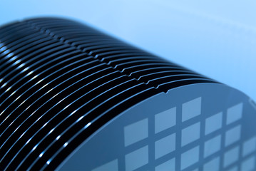 Close up of Silicon wafers grey color with chip cells prepared for production in a semiconductors...