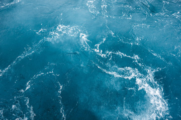 Blue ocean water texture, surface. Top view of aqua blue clear sea ocean. Beautiful blue sea water background.