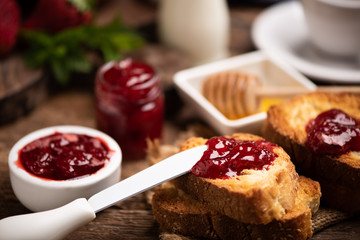 Fresh strawberry jam with bread for breakfast