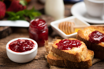 Fresh strawberry jam with bread for breakfast