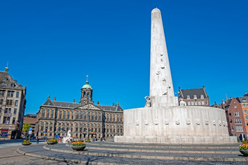 The Dam Square in Amsterdam Netherlands with the National Monument and the Royal Palace