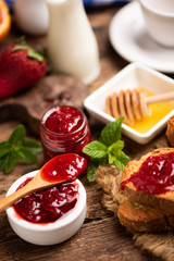 Fresh strawberry jam with bread for breakfast
