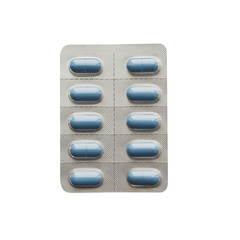 10 blue tablets in a silver blister on white isolated without shadow, flat lay