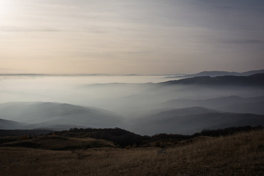 Low clouds over the mountains at sunset. (12000px)