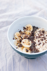 YOGURT BALL WITH BANANA OAT AND CHOCOLATE ON A WHITE BACKGROUND