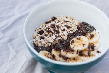 YOGURT BALL WITH BANANA OAT AND CHOCOLATE ON A WHITE BACKGROUND