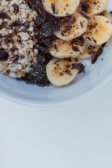 YOGURT BALL WITH BANANA OAT AND CHOCOLATE ON A WHITE BACKGROUND
