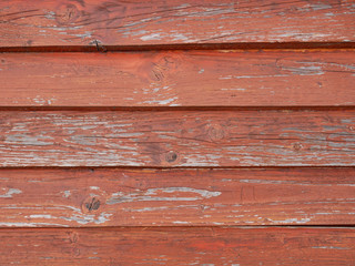 Old weathered wooden roof pained in red