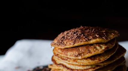 OAT CAKES WITH CHOCOLATE ON A BLACK BACKGROUND